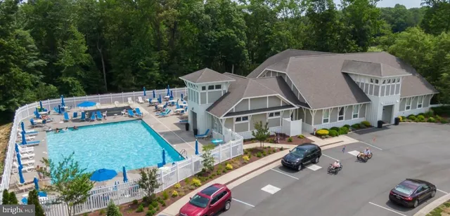 an aerial view of a house with garden space and street view