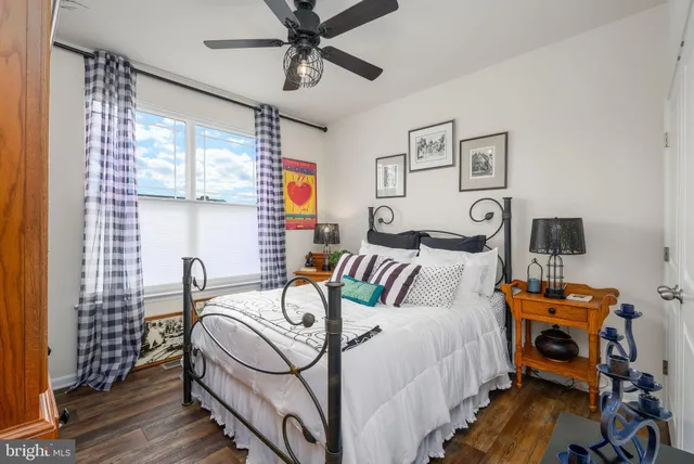 a bedroom with bed and a window