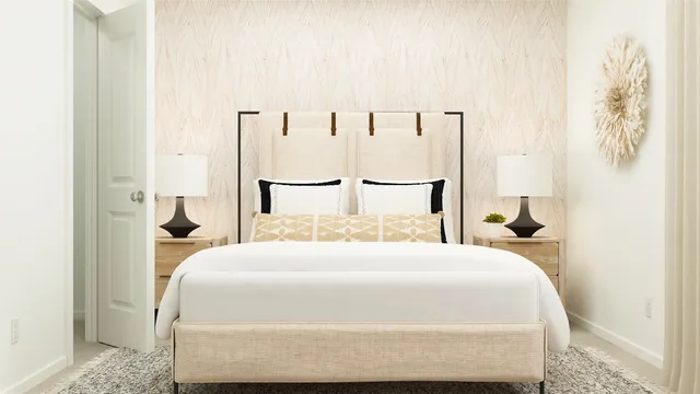 a bedroom with a large bed and paintings on the wall