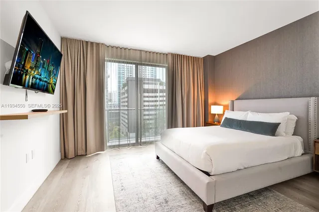 a view of a hallway with wooden cabinets