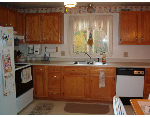 53 Clark Road Sturbridge, MA 01518 - Photo 4 of 5 a kitchen with stainless steel appliances granite countertop a sink stove and cabinets