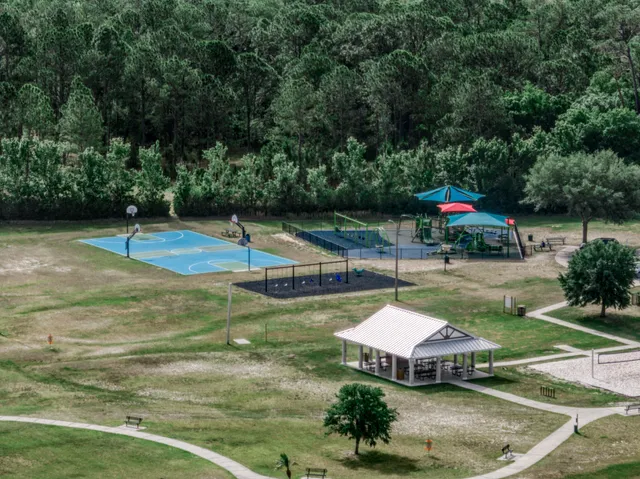 a swimming pool with some trees in the background