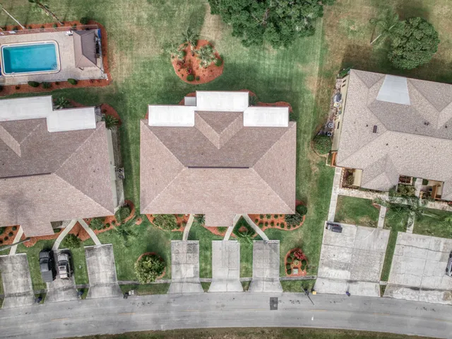 an aerial view of a house with a garden