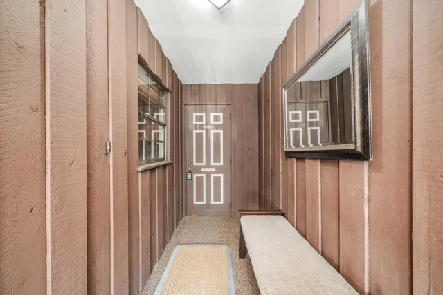 a view of a hallway with windows