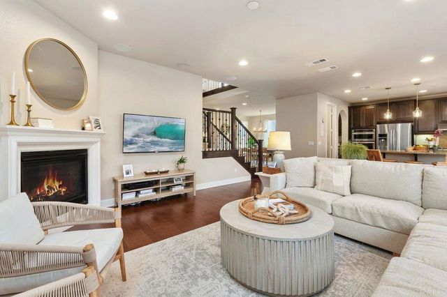 a living room with furniture and a table