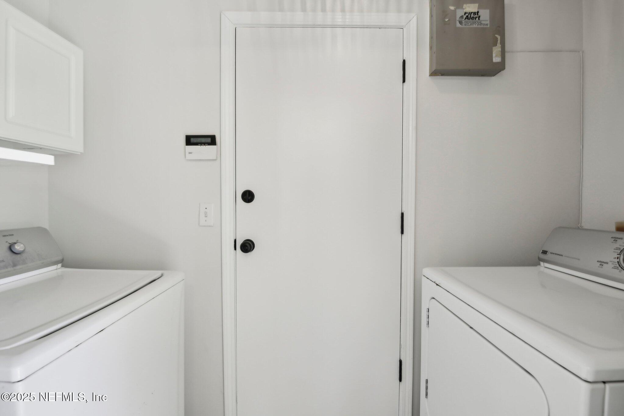 8138 Westport Road Jacksonville, FL 32244 - Photo 12 of 45 a utility room with dryer and washer