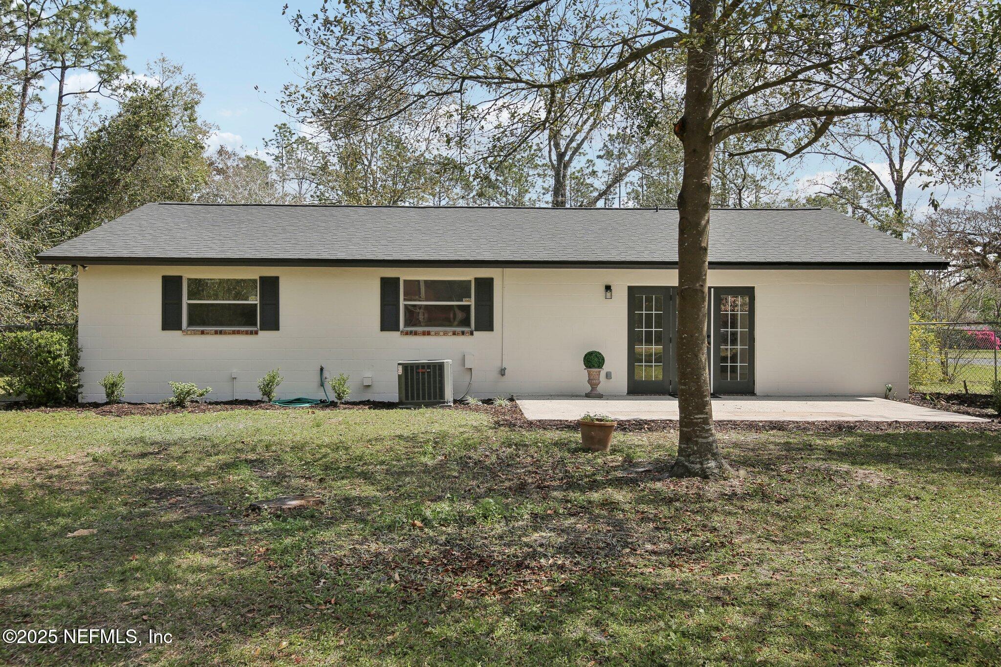 8138 Westport Road Jacksonville, FL 32244 - Photo 30 of 45 a house that has a tree in front of it