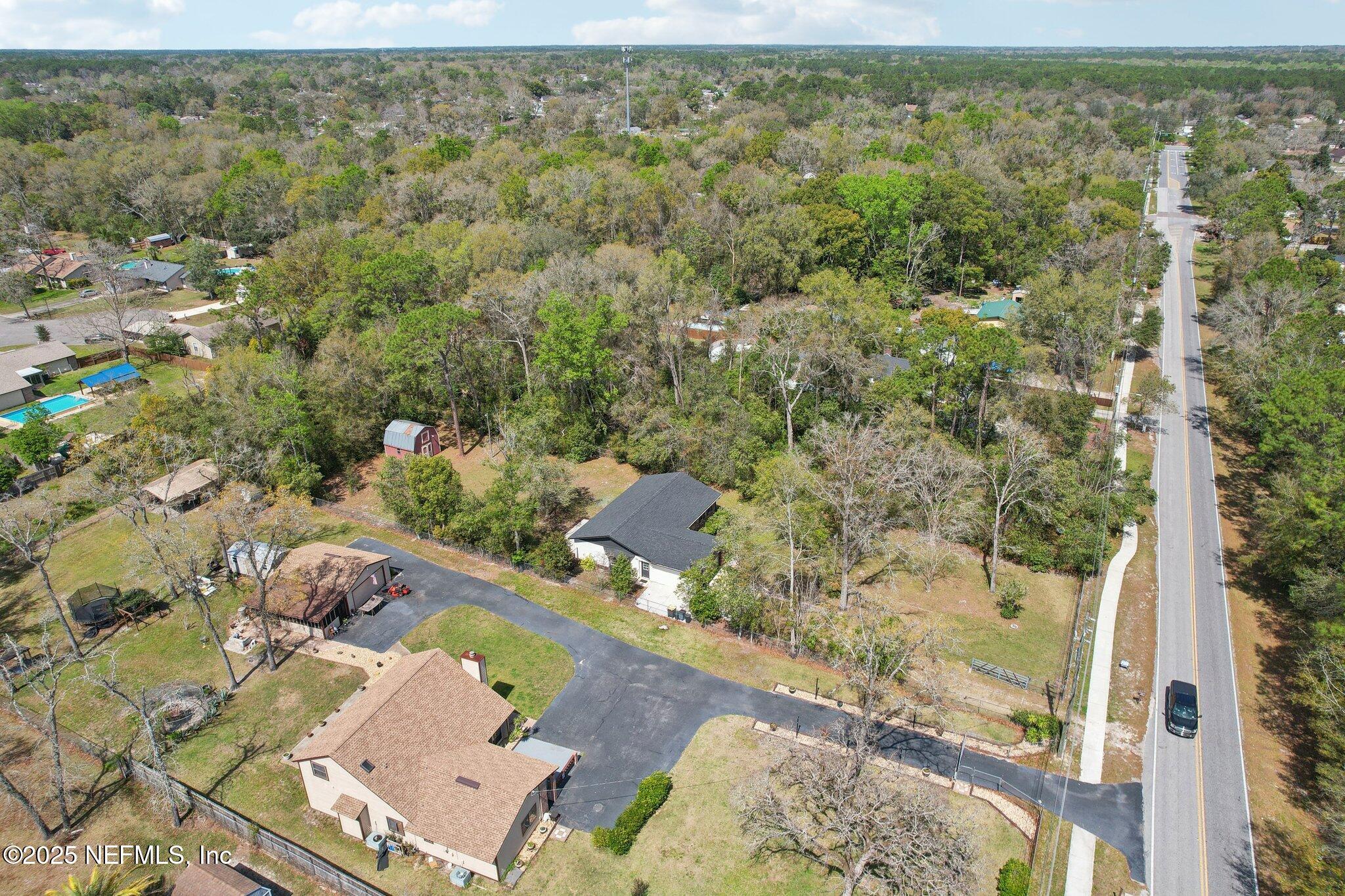 8138 Westport Road Jacksonville, FL 32244 - Photo 33 of 45 an aerial view of a house with a yard