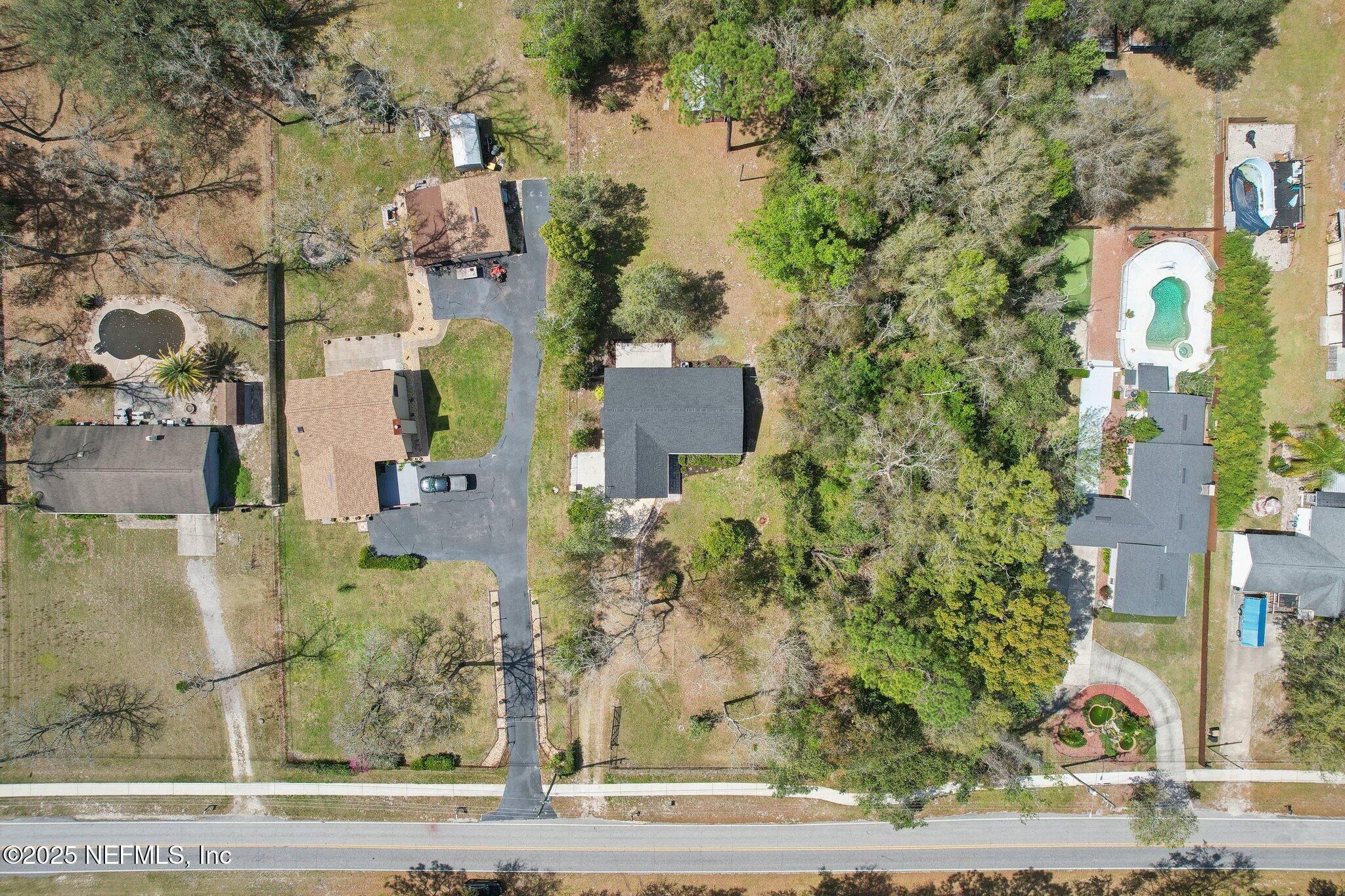 8138 Westport Road Jacksonville, FL 32244 - Photo 34 of 45 an aerial view of residential houses with yard