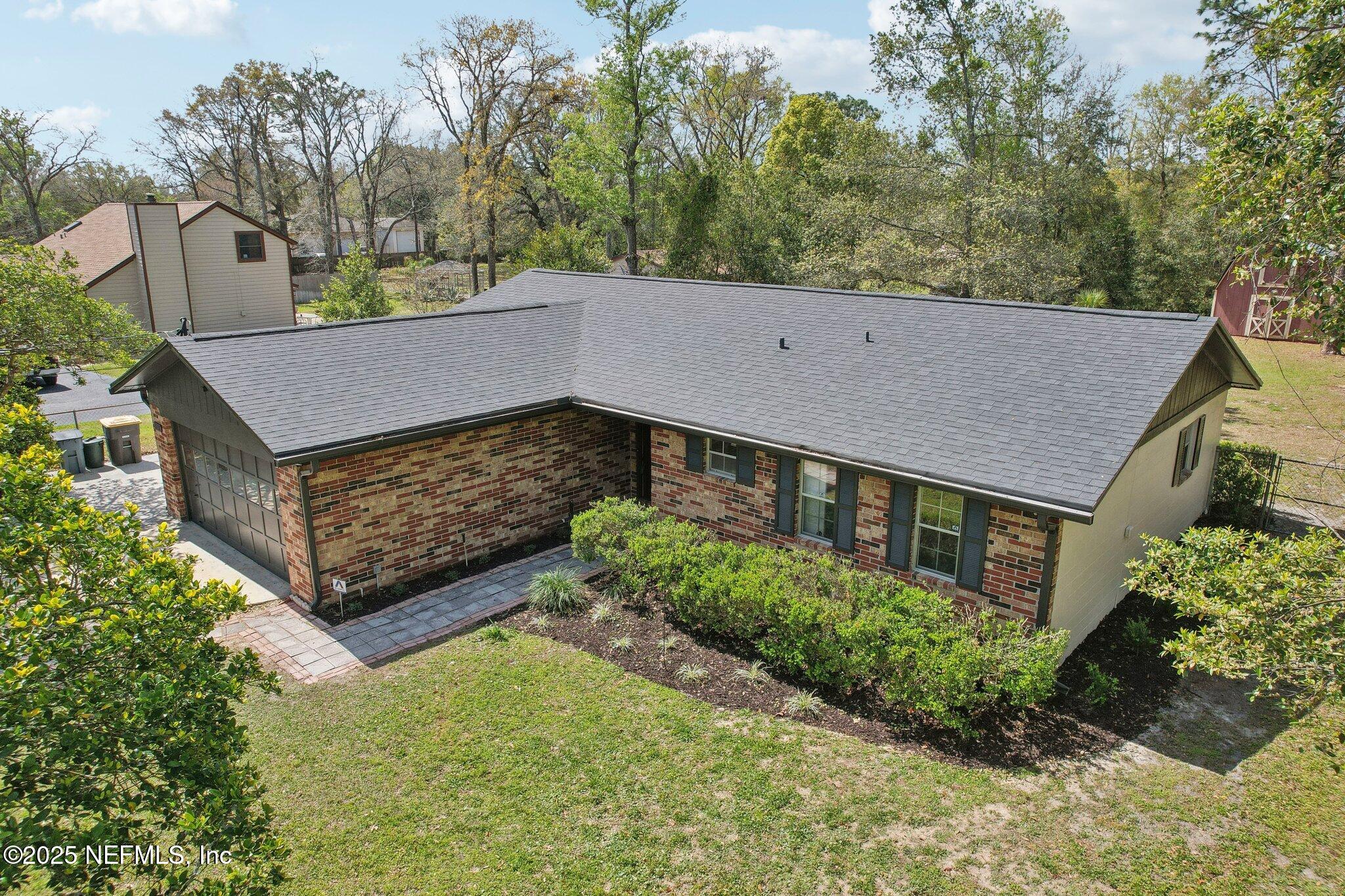 8138 Westport Road Jacksonville, FL 32244 - Photo 35 of 45 front view of a house with a yard