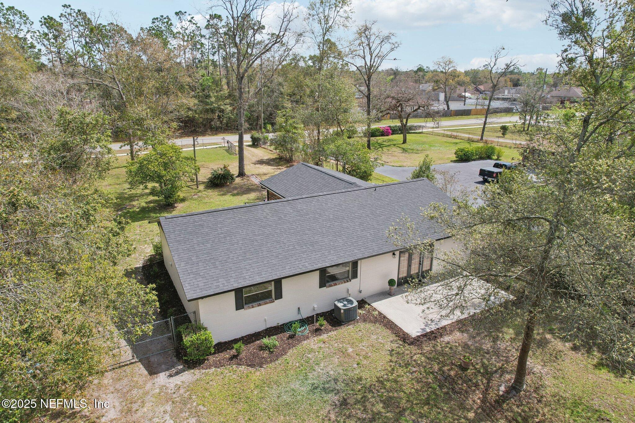 8138 Westport Road Jacksonville, FL 32244 - Photo 40 of 45 an aerial view of a house with garden space and street view