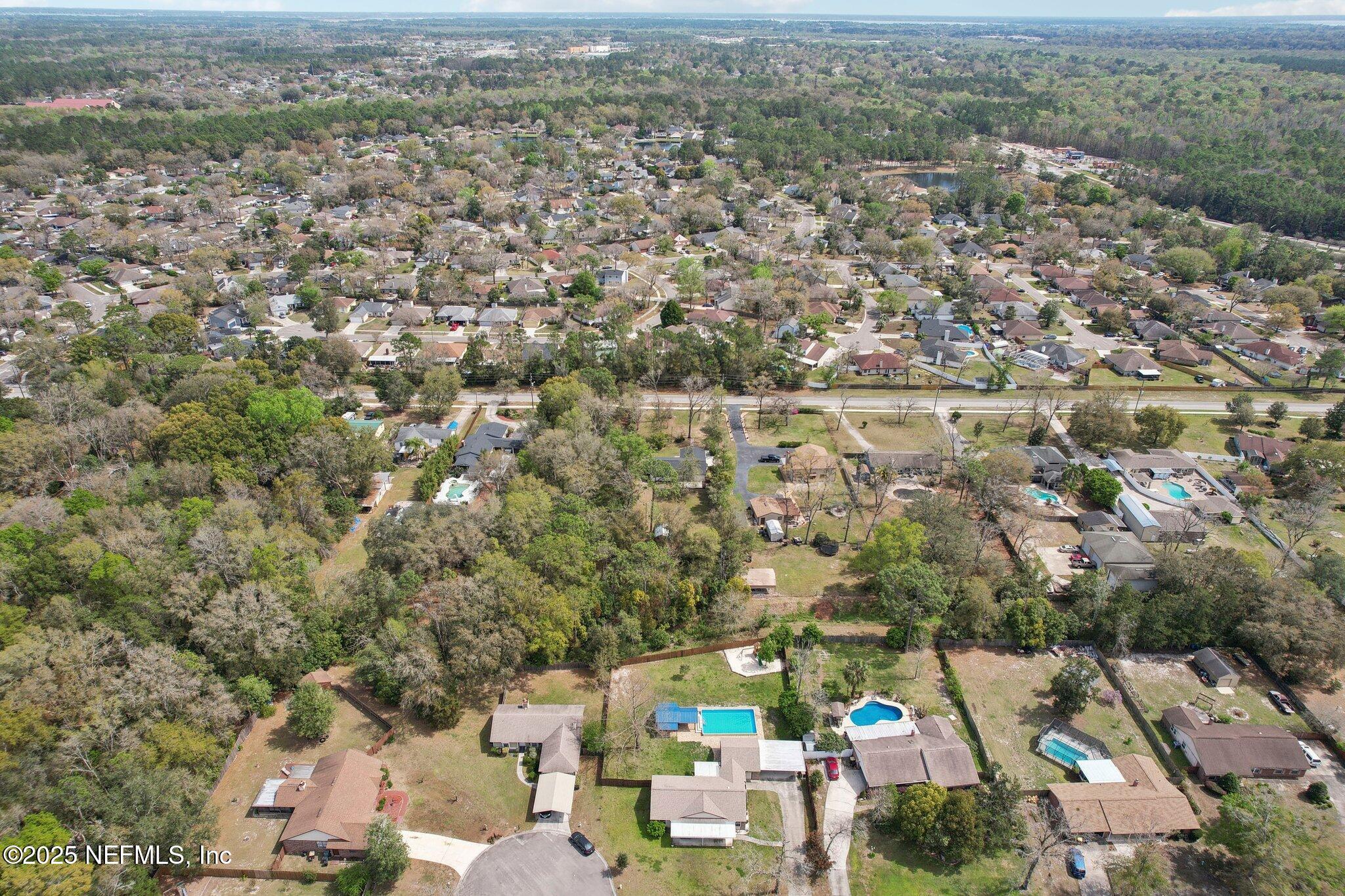 8138 Westport Road Jacksonville, FL 32244 - Photo 42 of 45 an aerial view of a city with lots of residential buildings