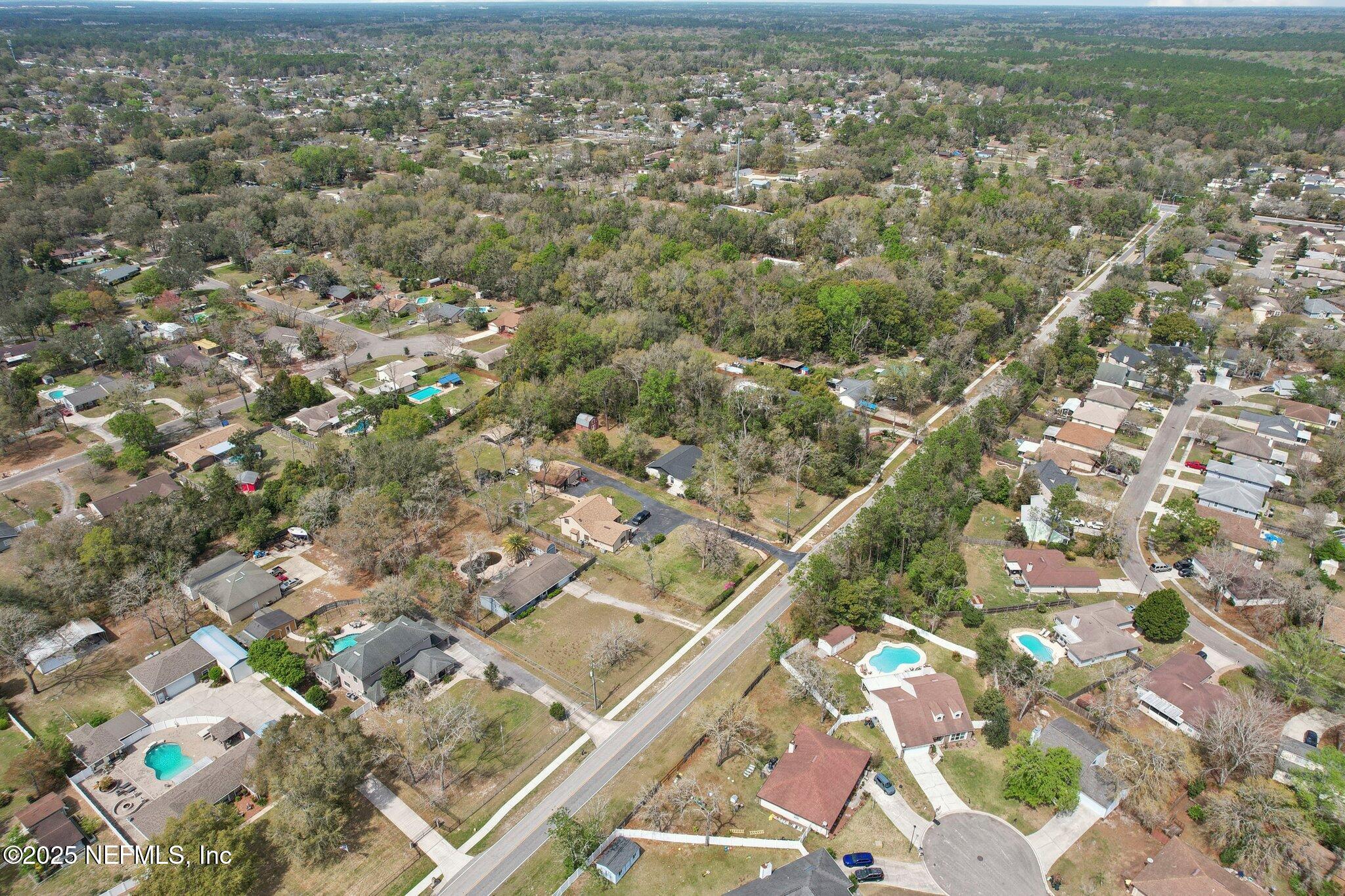 8138 Westport Road Jacksonville, FL 32244 - Photo 43 of 45 an aerial view of residential houses with outdoor space