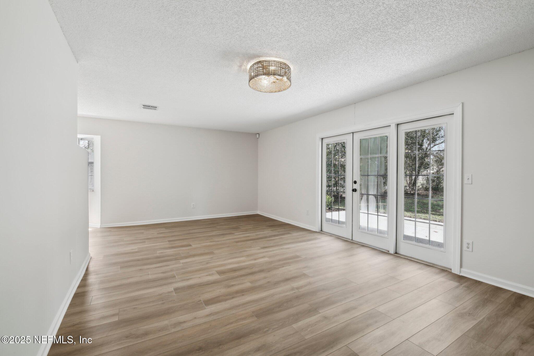 8138 Westport Road Jacksonville, FL 32244 - Photo 7 of 45 a view of an empty room with a window
