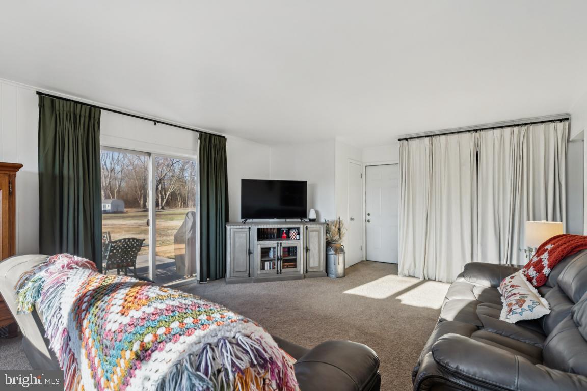 81 Harvard Road Pennsville, NJ 08070 - Photo 13 of 32 a bedroom with a bed and a television