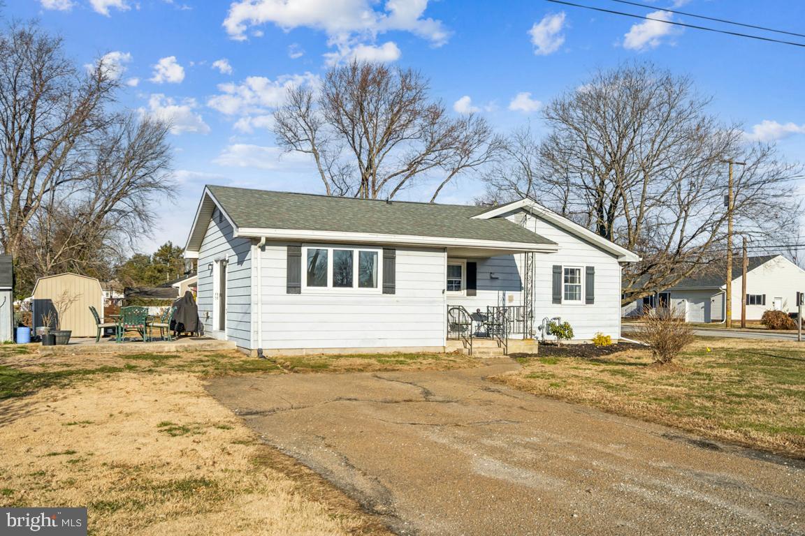 81 Harvard Road Pennsville, NJ 08070 - Photo 21 of 32 a front view of a house with a yard covered with snow