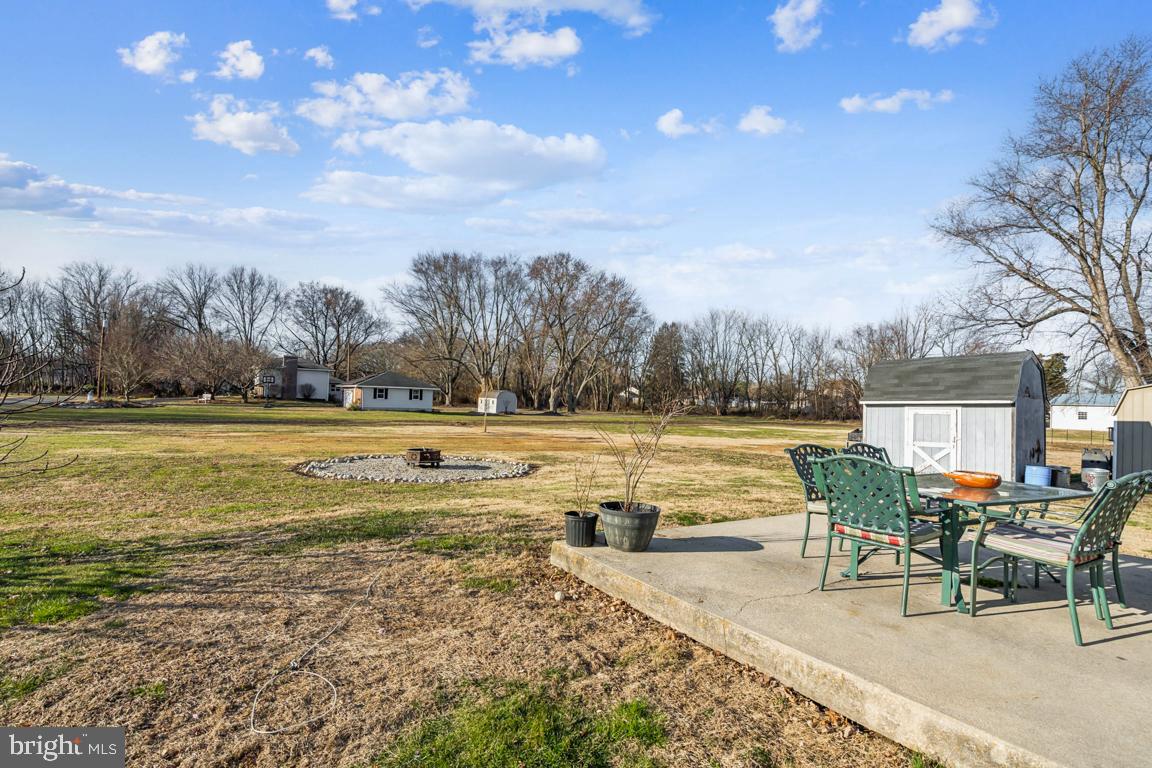 81 Harvard Road Pennsville, NJ 08070 - Photo 22 of 32 a view of a swimming pool with lawn chairs and lounge chairs