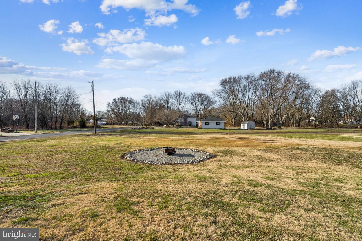 81 Harvard Road Pennsville, NJ 08070 - Photo 23 of 32 a view of outdoor space with swimming pool and green space