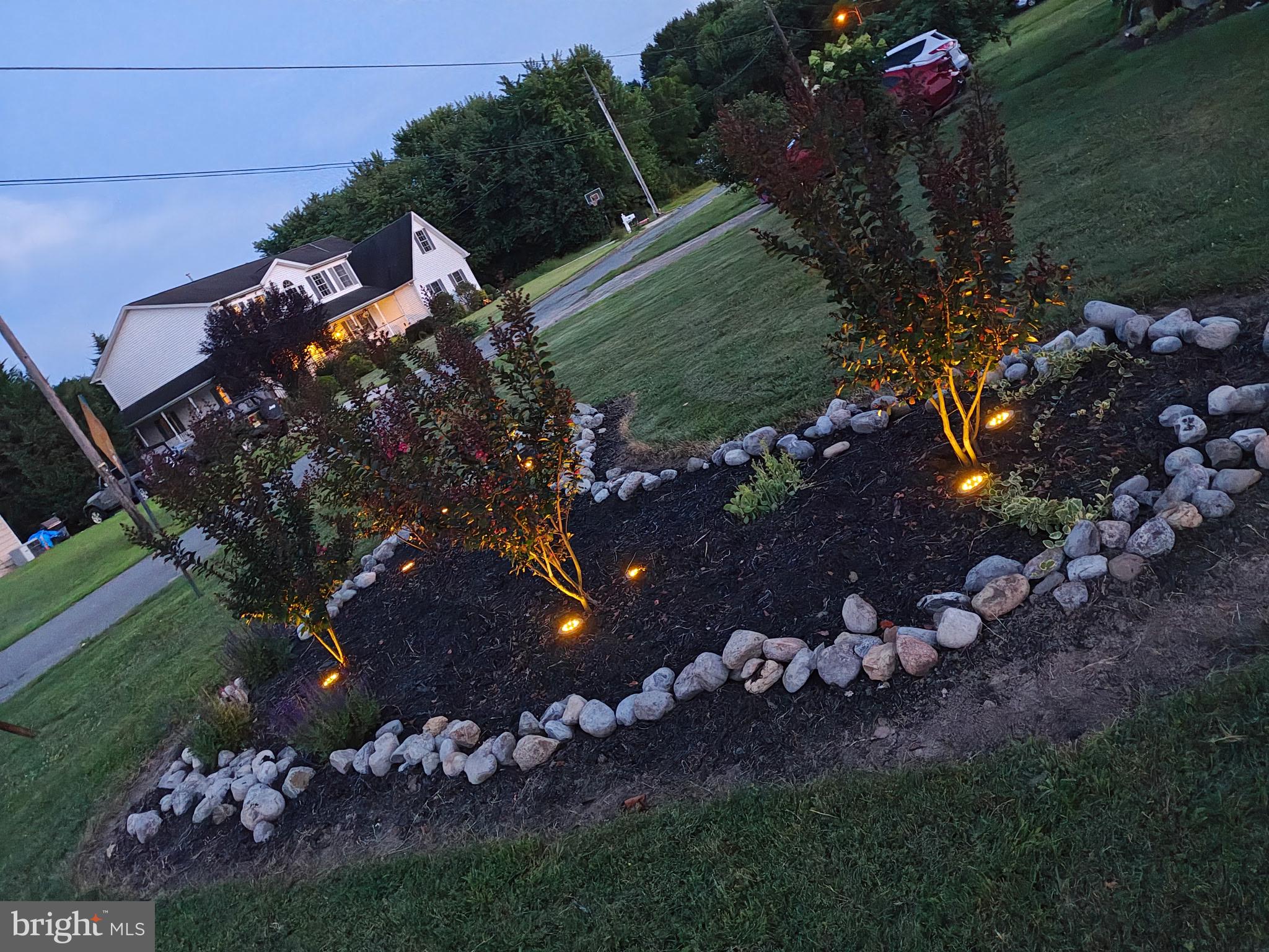 81 Harvard Road Pennsville, NJ 08070 - Photo 28 of 32 a view of a tree in a yard next to a building