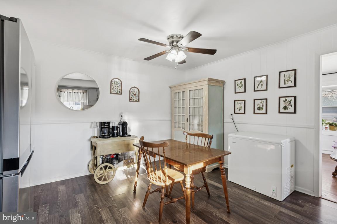 81 Harvard Road Pennsville, NJ 08070 - Photo 10 of 32 a view of a dining room with furniture and wooden floor
