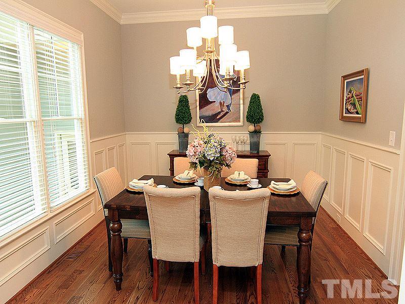 3341 Hampton Road Raleigh, NC 27607 - Photo 4 of 25 a dining room with furniture a potted plant and wooden floor