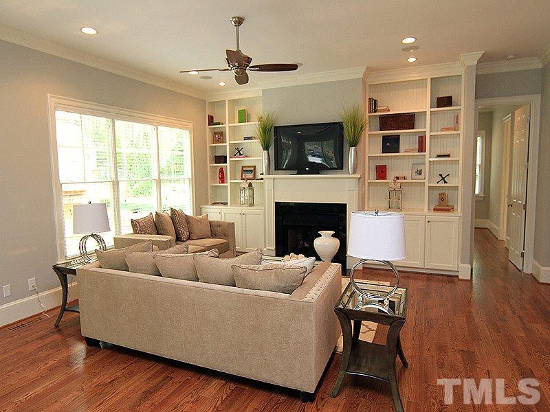 3341 Hampton Road Raleigh, NC 27607 - Photo 5 of 25 a living room with furniture and a fireplace