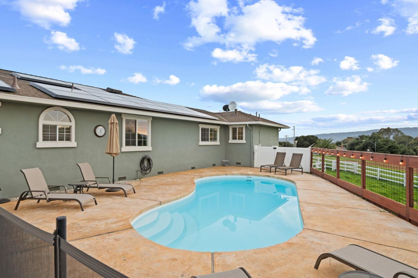 2985 Roop Road Gilroy, CA 95020 - Photo 20 of 41 a swimming pool with outdoor seating