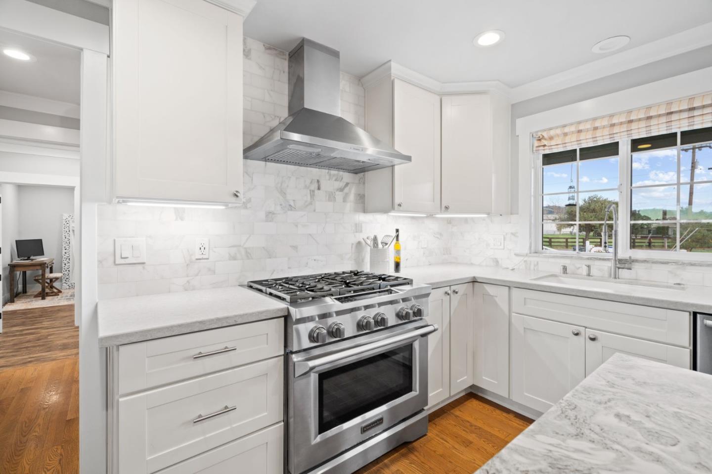 2985 Roop Road Gilroy, CA 95020 - Photo 5 of 41 a kitchen with granite countertop a stove and a sink