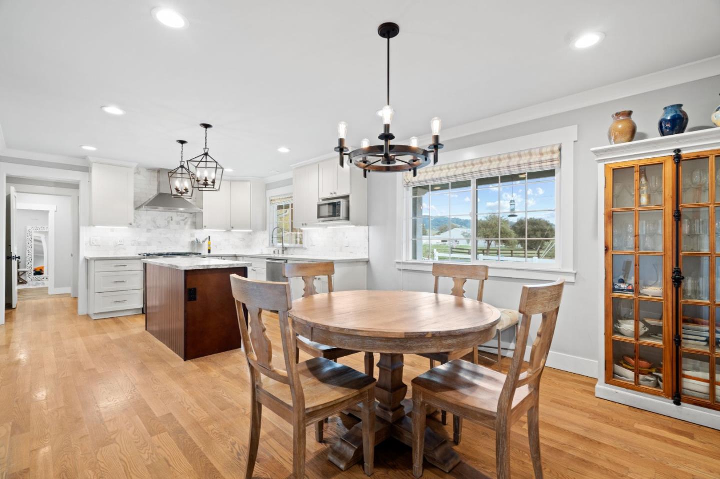2985 Roop Road Gilroy, CA 95020 - Photo 7 of 41 a view of a dining room with furniture wooden floor kitchen and a chandelier