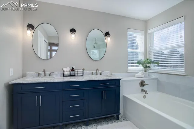a bathroom with a double vanity sink and a mirror
