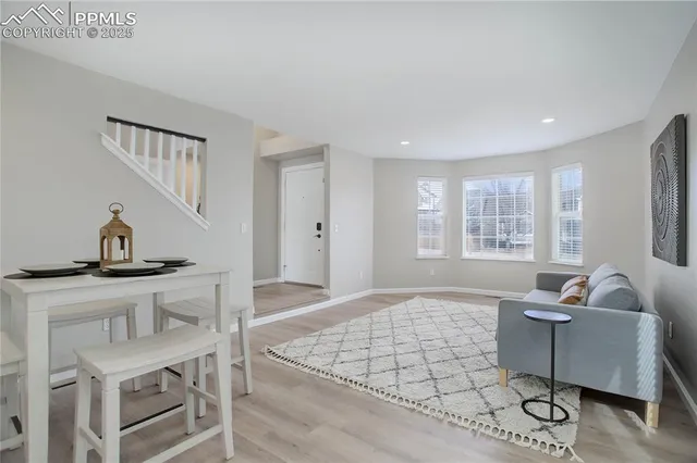 a living room with furniture and a window