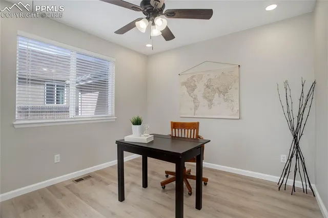 a workspace with furniture and a window