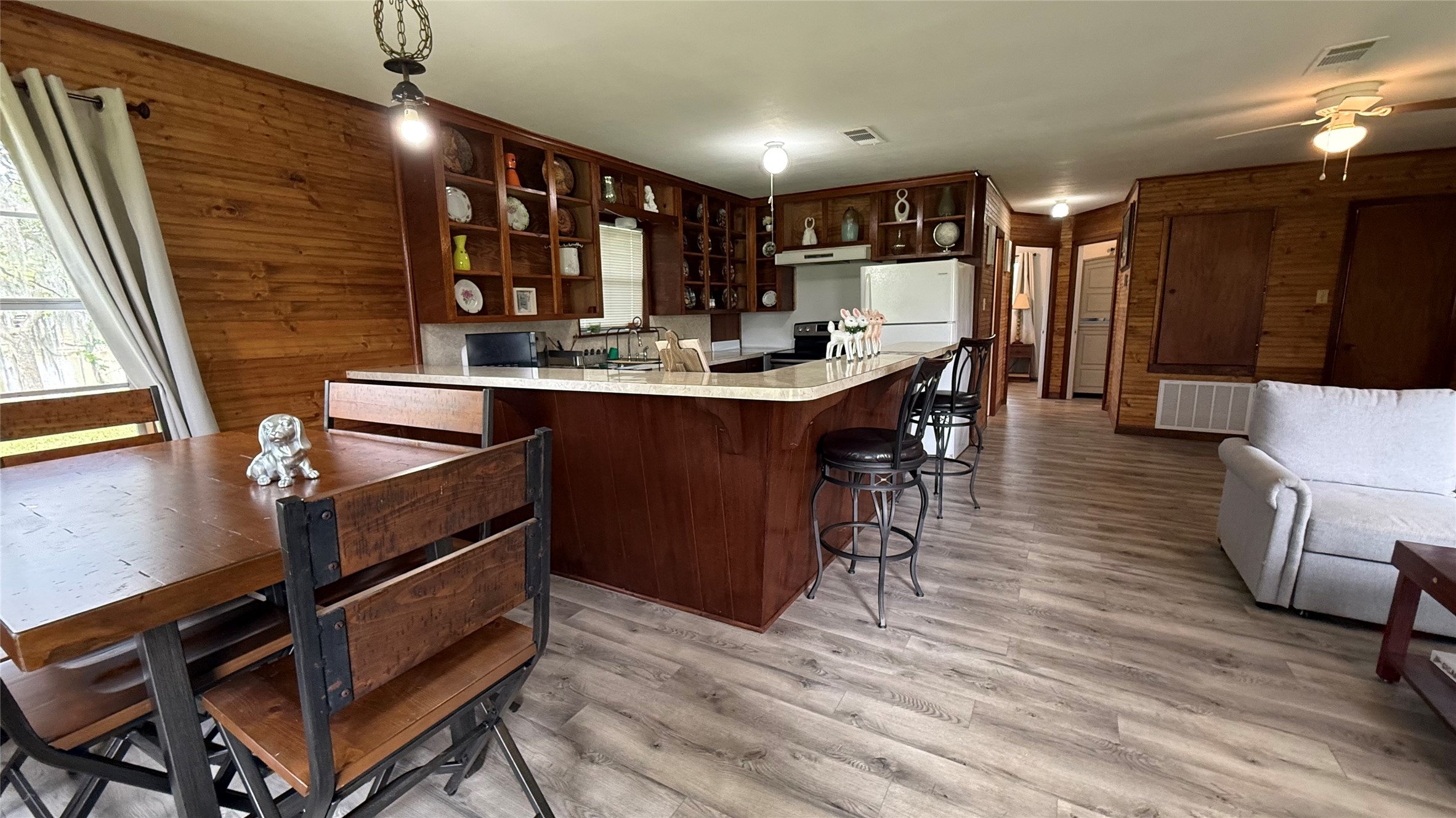 215 Weldon Livingston, TX 77351 - Photo 9 of 22 a kitchen with stainless steel appliances granite countertop a sink stove and refrigerator