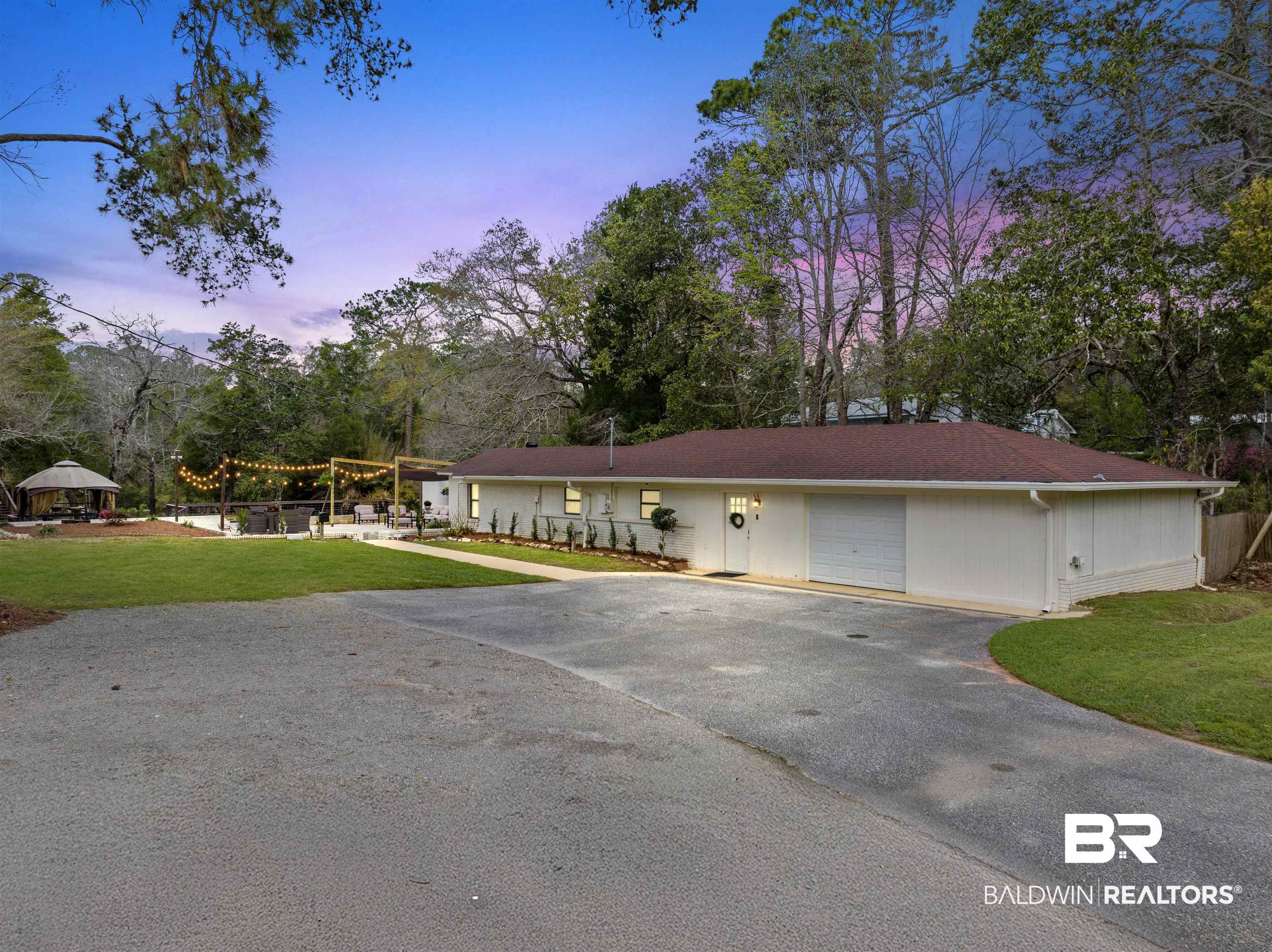 17595 River Road Summerdale, AL 36580 - Photo 29 of 29 Ranch-style home with a yard, driveway, view of wooded area, a pergola, and a garage