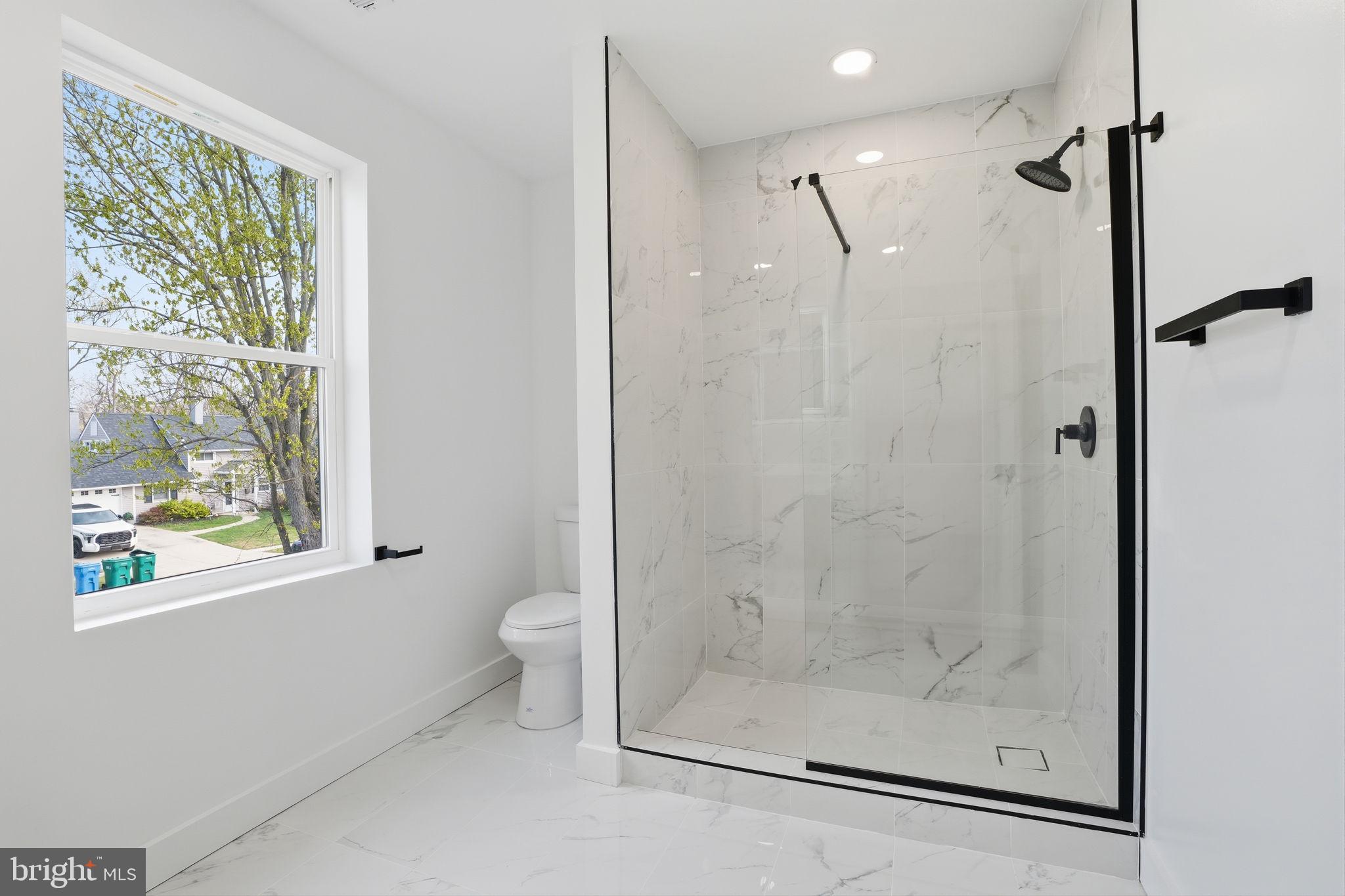 14 Inlet Road Levittown, PA 19057 - Photo 19 of 31 a bathroom with a glass shower door