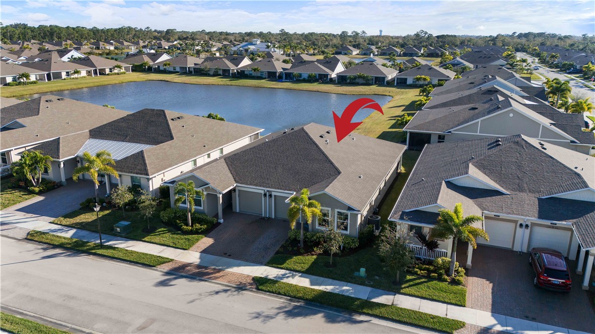 6187 Red Maple Manor Vero Beach, FL 32966 - Photo 24 of 31 an aerial view of a houses with yard
