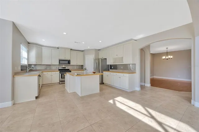a large kitchen with cabinets