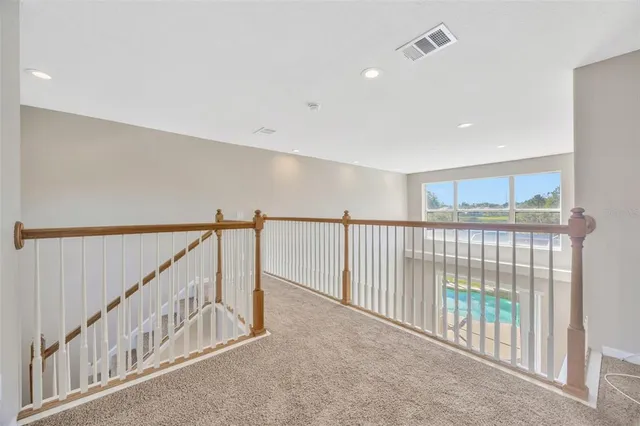 a view of staircase with lots of windows