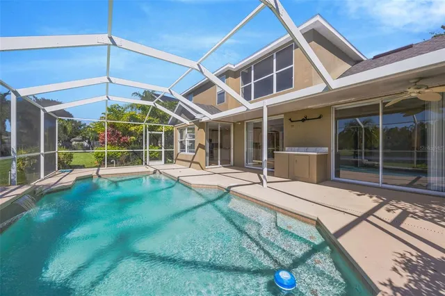 a view of a house with a backyard porch and sitting area
