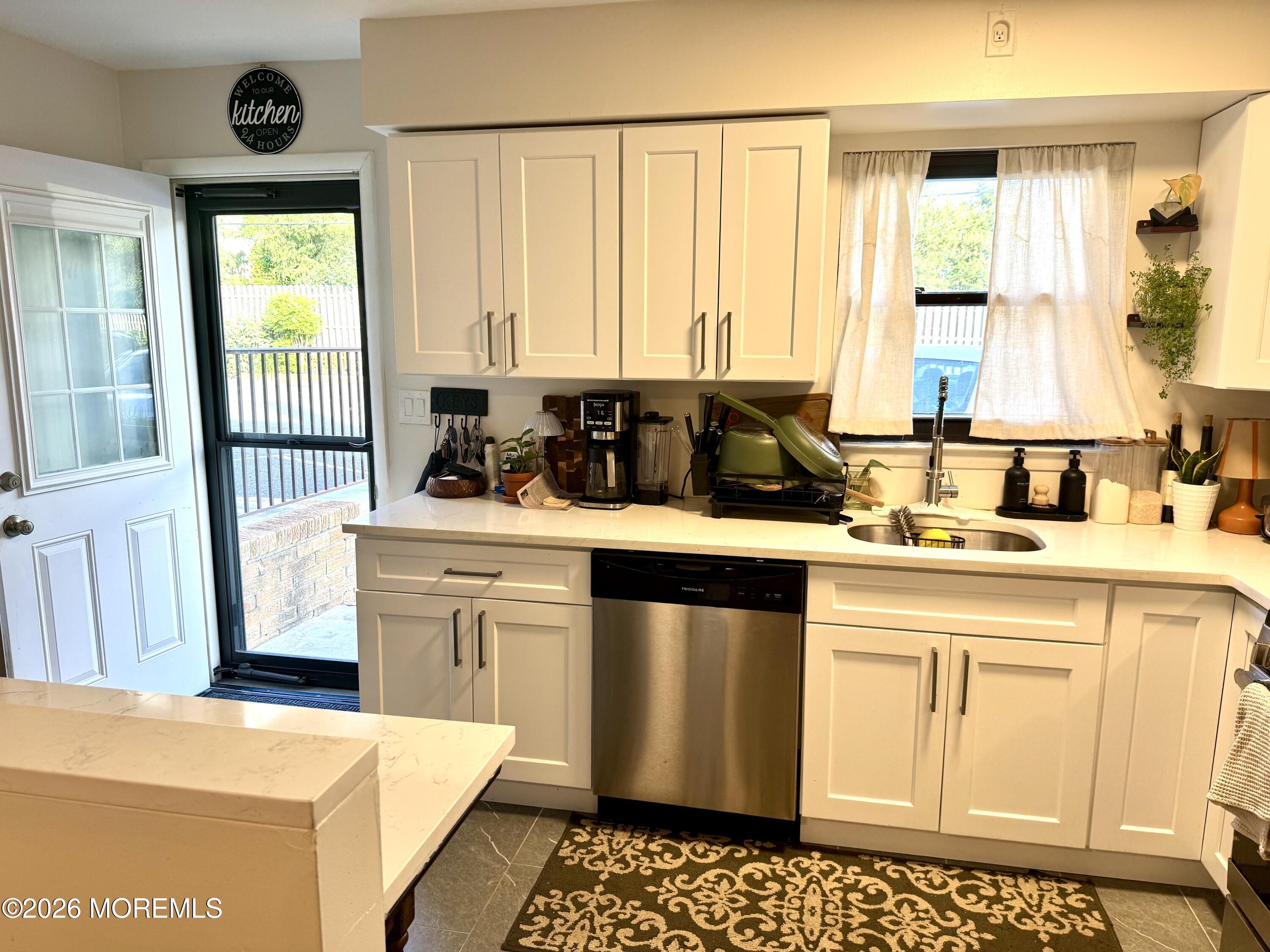 321 Spring Street, Unit 8 Red Bank, NJ 07701 - Photo 5 of 19 Kitchen and back door