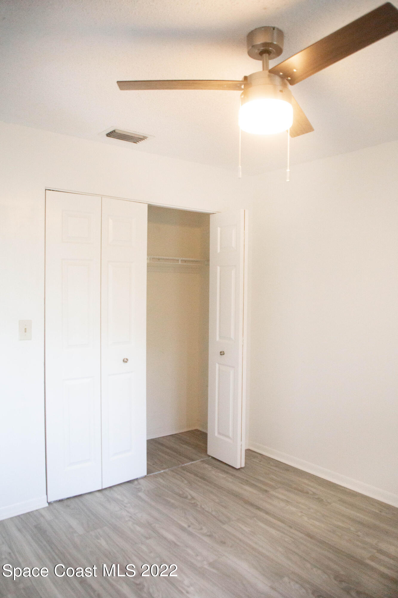714 Ridge Club Drive, Unit 40 Melbourne, FL 32934 - Photo 10 of 14 a view of a room with wooden floor