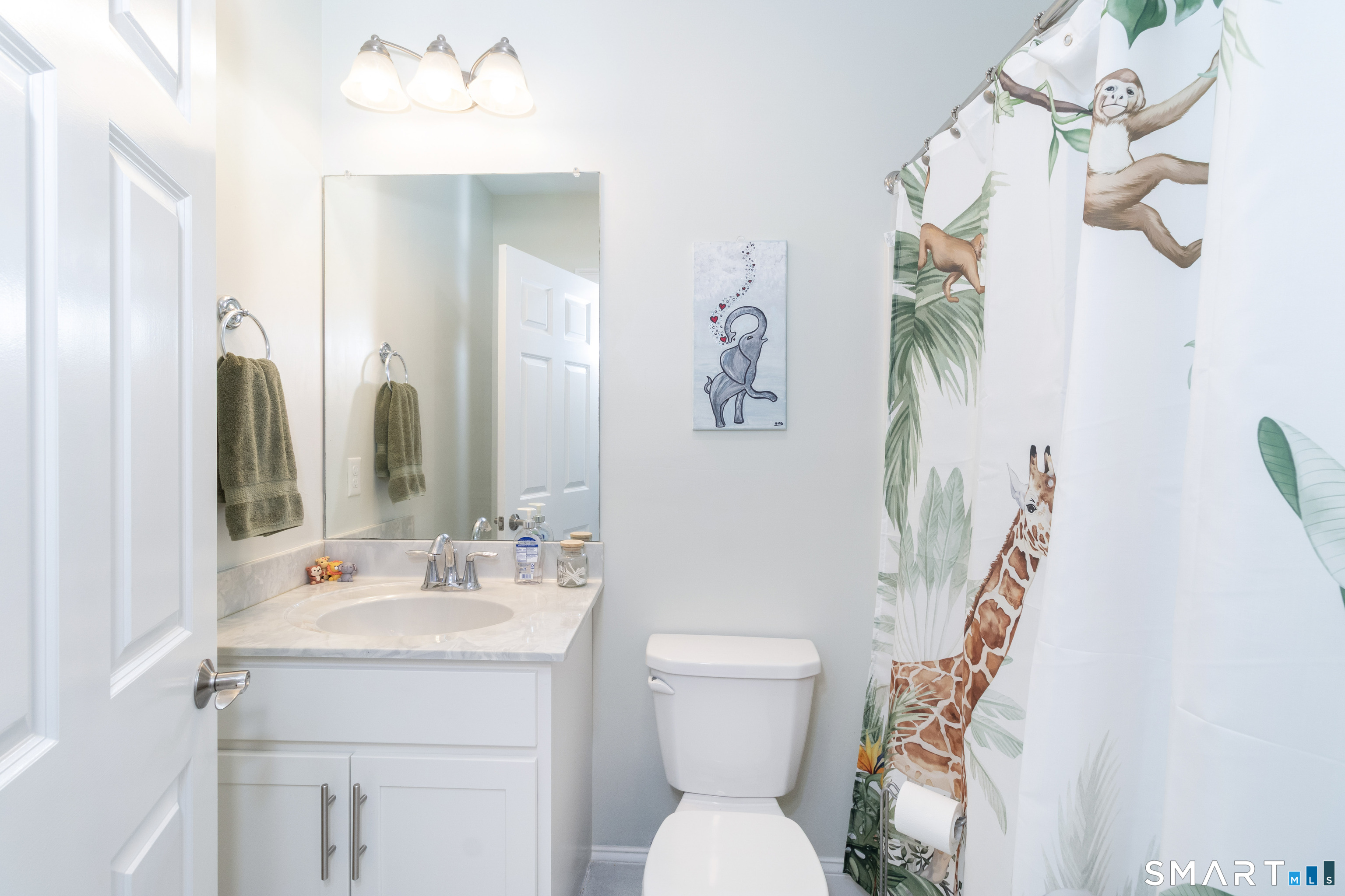 656 Bartholomew Road, Unit 656 Middletown, CT 06457 - Photo 18 of 27 a bathroom with a toilet sink and mirror