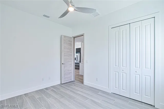 an empty room with closet area