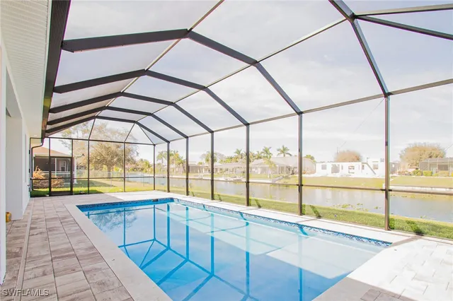 a bathroom with a large window and a bath tub