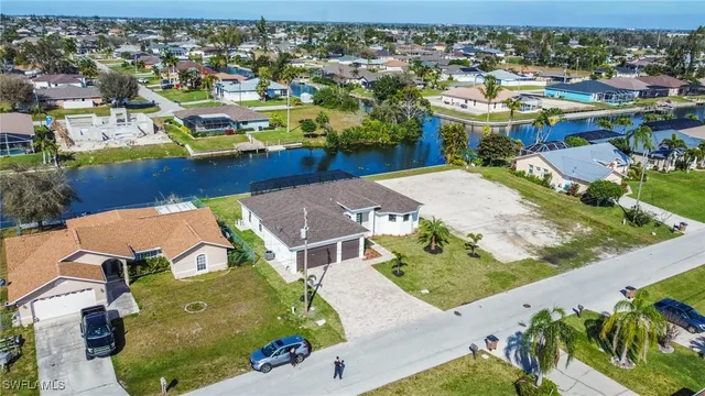 an aerial view of a house with a swimming pool outdoor seating and yard view
