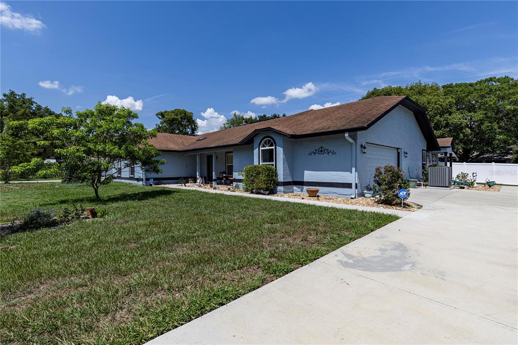5521 Oak Street Mount Dora, FL 32757 - Photo 1 of 1 a front view of a house with a yard and trees