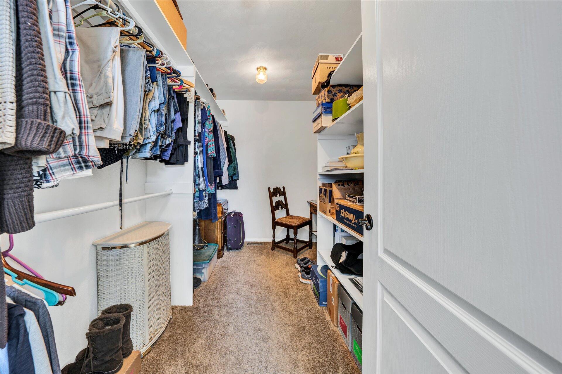 1015 Green Level Road Boones Mill, VA 24065 - Photo 35 of 51 a view of walk in closet with clothes and shoes