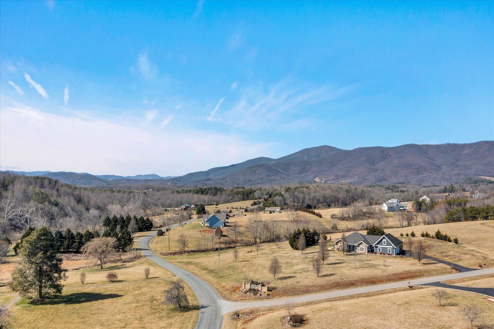 1015 Green Level Road Boones Mill, VA 24065 - Photo 47 of 51 a view of a lake with mountains in the background