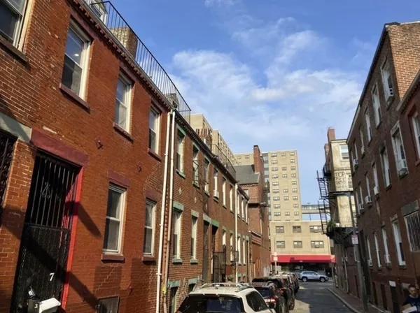 a city street lined with tall buildings