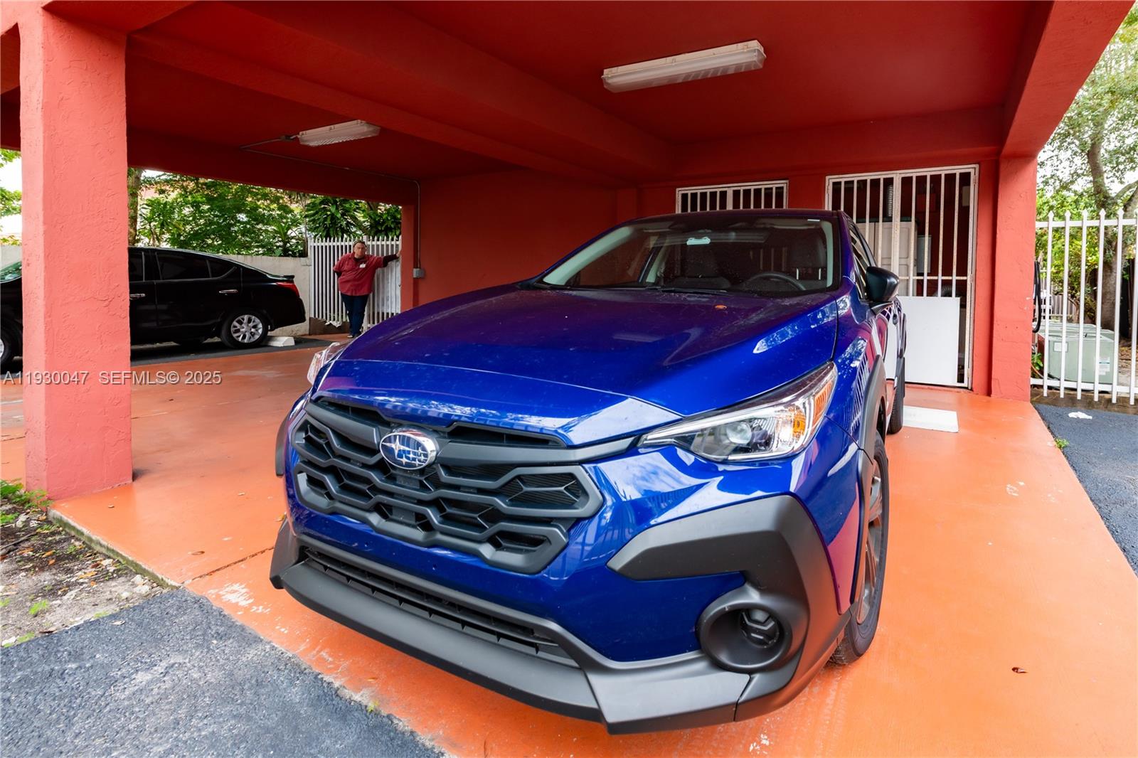 63 Northwest 17th Place, Unit 6 Miami, FL 33125 - Photo 23 of 25 a car parked in front of a building